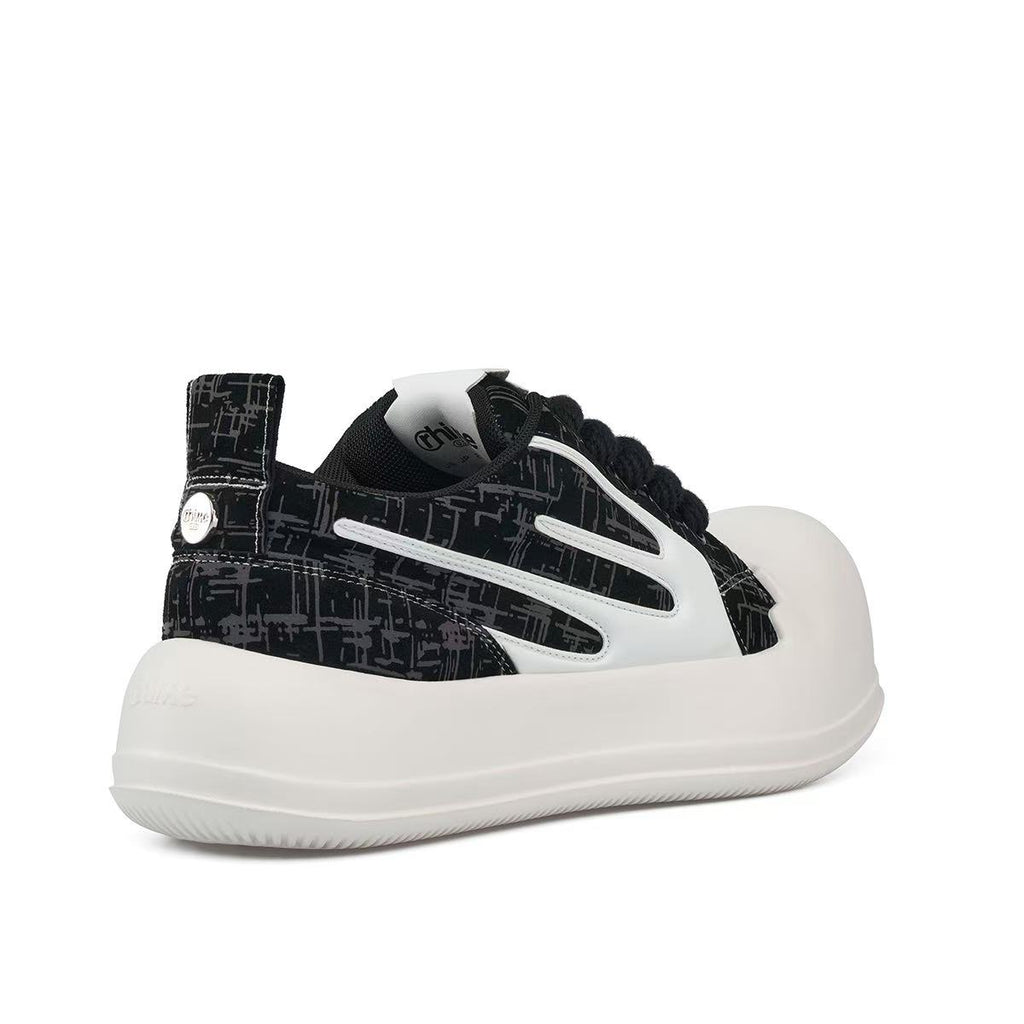 AstroPod 3M Reflective sneaker with black patterned uppers, white side accents and off-white soles, viewed at an angle from the heel and side.