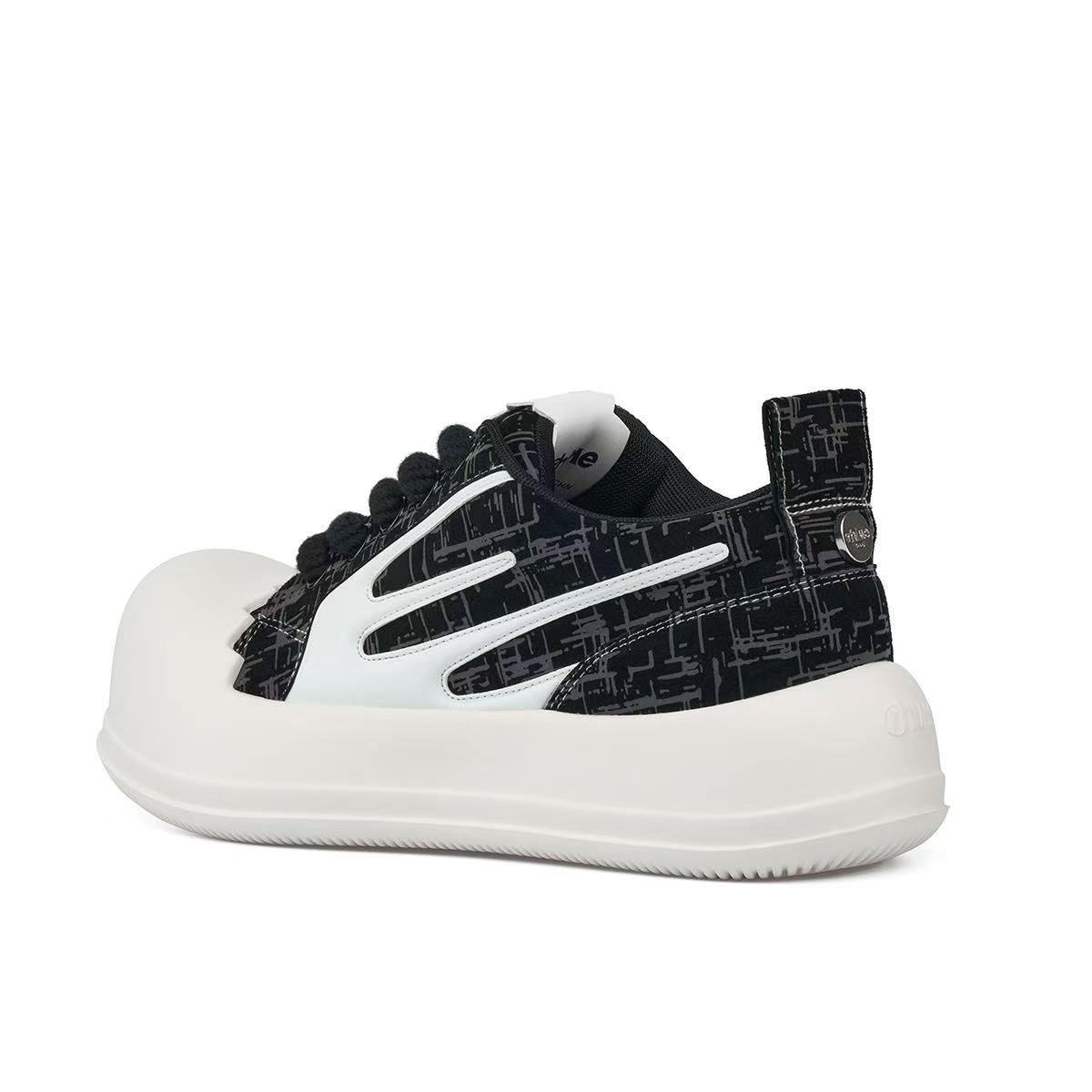 AstroPod 3M Reflective sneaker with black patterned uppers, white side accents and off-white soles, viewed at an angle from the heel and side.