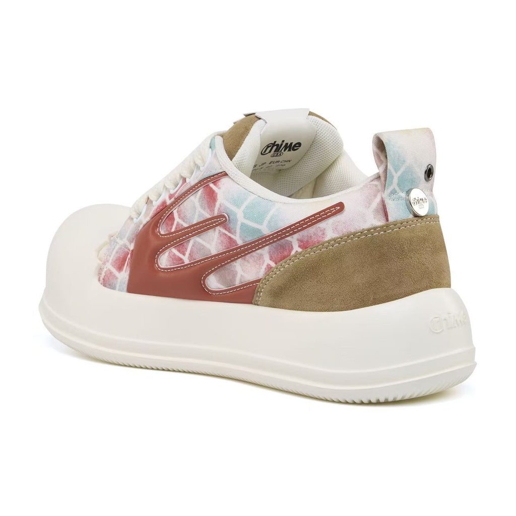 AstroPod Babyface Ray Wavy sneaker with pastel-patterned uppers, brown side accents and white soles, viewed at an angle from the heel and side.