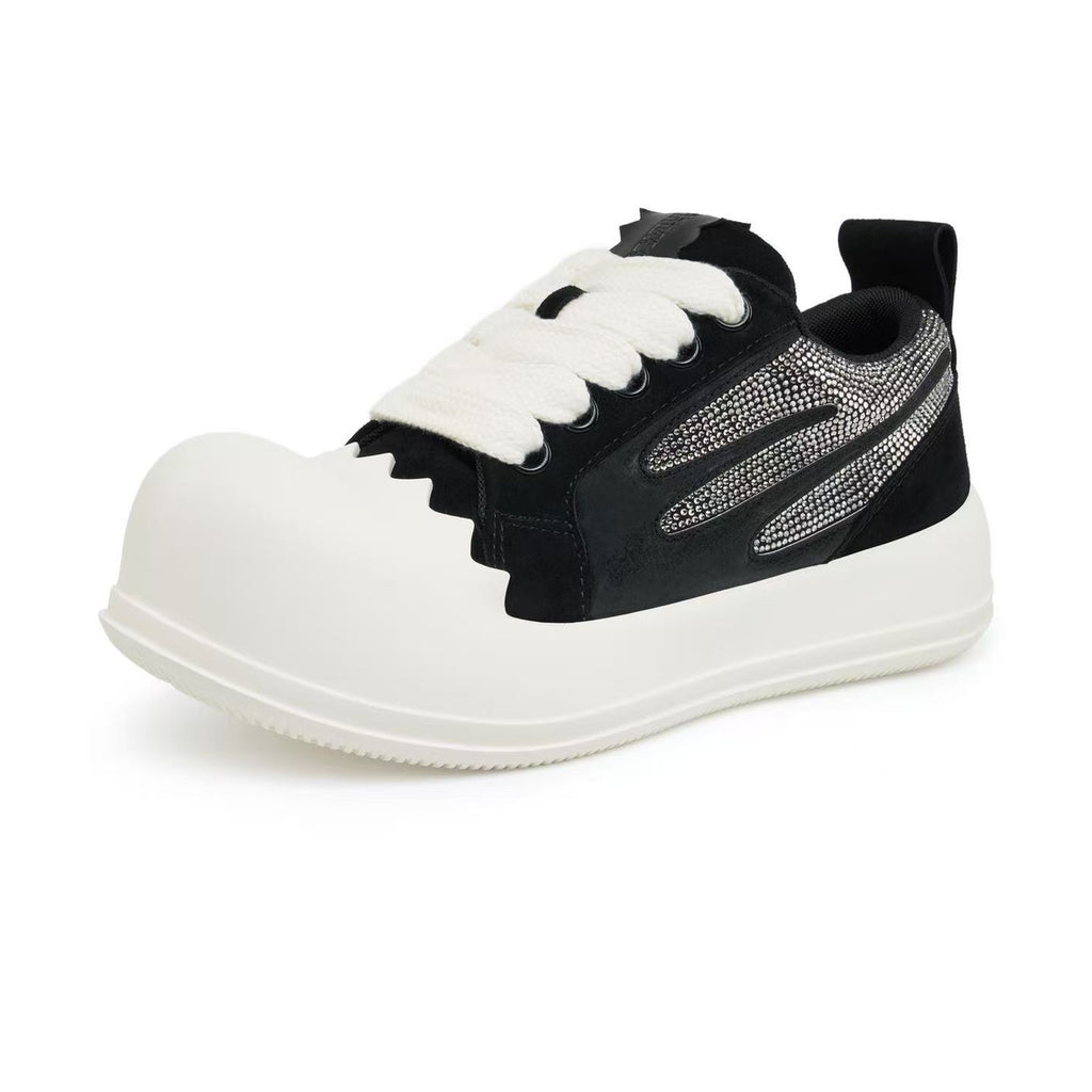 AstroPod Black Rhinestone Onyx sneaker with black uppers, silver-tone rhinestones and off-white soles, viewed from the front and outer side with the toe pointing left.