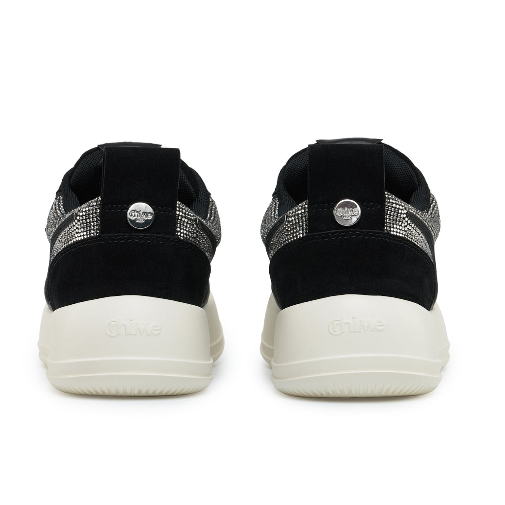 Black Rhinestone Onyx AstroPod pair seen from behind, with black heels, silver-tone trim and off-white soles.