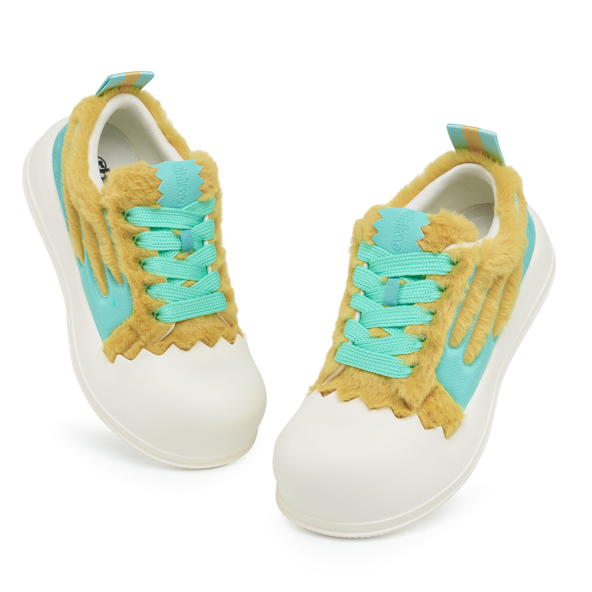 AstroPod DeJ Loaf Yellow World pair with fluffy yellow uppers, turquoise accents and white soles, viewed from above at an angle.