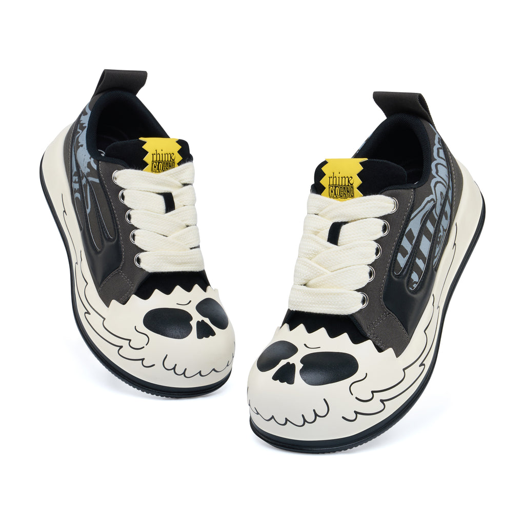AstroPod Glo Gang pair with gray-and-black graphics, white laces and printed light-colored sidewalls, viewed from above at an angle.