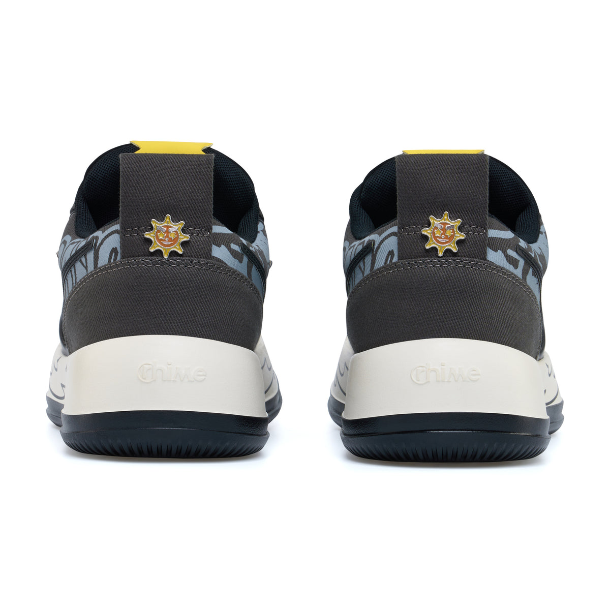 Glo Gang AstroPod pair seen from behind, with dark heels, sun-shaped emblems and black tread edges.